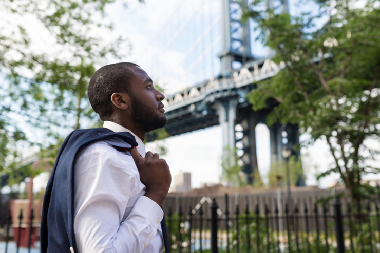 Professional man looking at the Brooklyn bridge