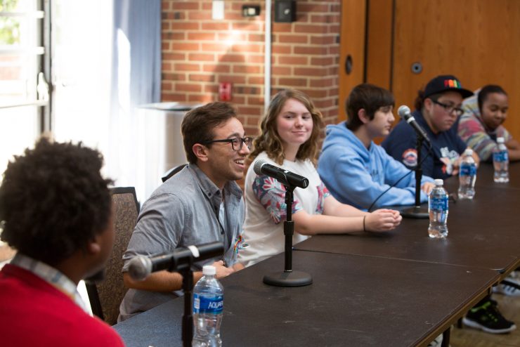 Transgender Advocate and Alumnus, Mena Sposito (they/them), speaks on a  panel for National Coming Out Day.