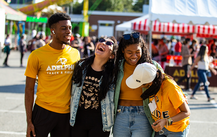 ӰƬ students laughing together at the Panther Carnival during ӰƬ University Spirit Weekend