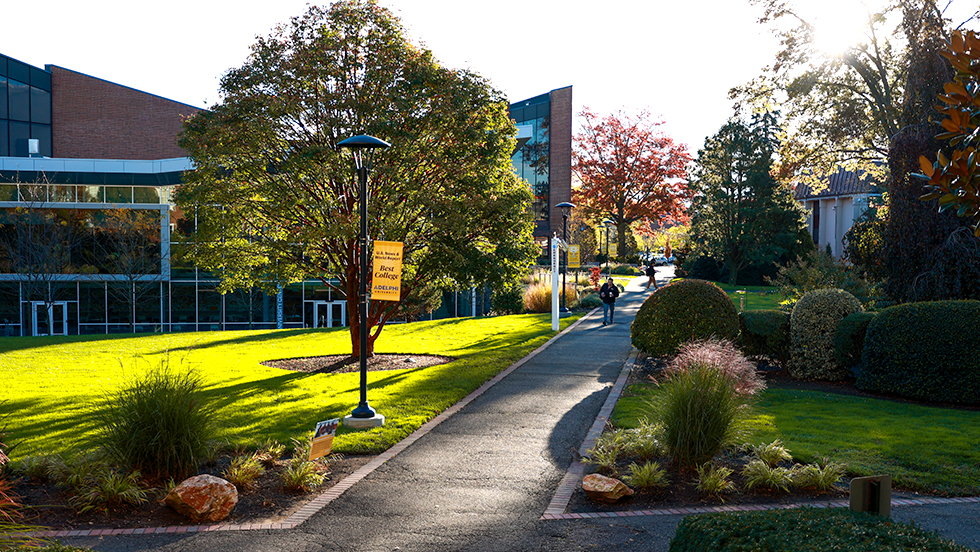 A view of ӰƬ University's main Garden City Campus in the fall. The Ruth S. Harley University Center and pathways.