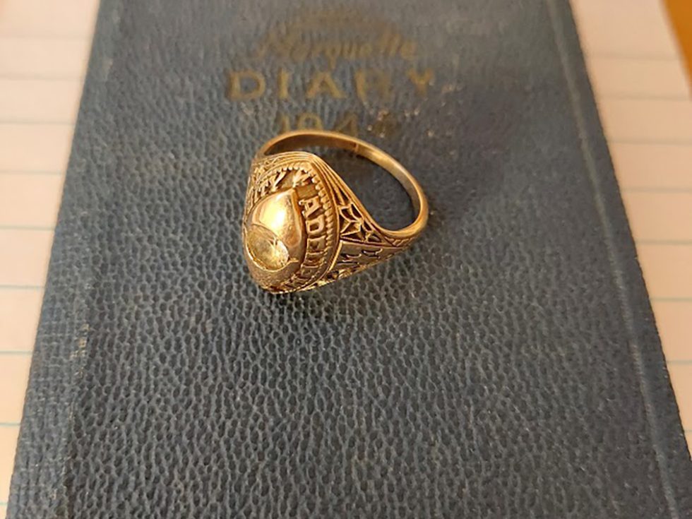 gold 成人影片 class ring lying on a book